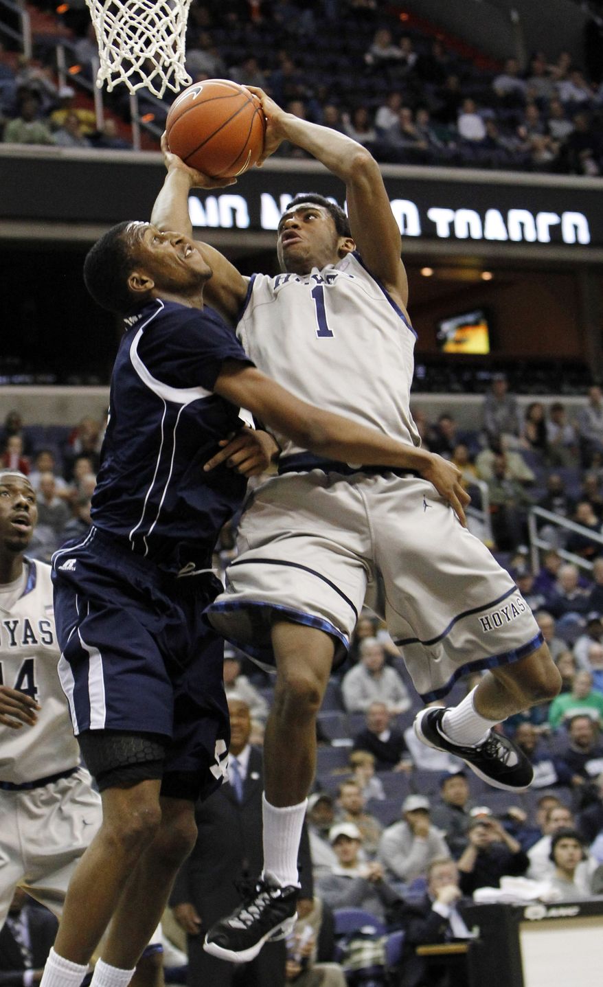 Georgetown forward Hollis Thompson goes to the basket against Howard center Oliver Ellison during the second half in Washington, Saturday, Dec. 10, 2011. Georgetown beat Howard 62-48 and Thompson had 12 points. (AP Photo/Ann Heisenfelt)