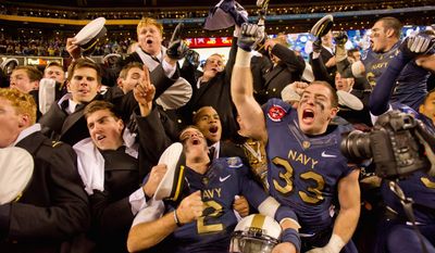 photographs by Andrew Harnik / The Washington Times
Navy finished 5-7 and out of the bowl picture, but quarterback Kriss Proctor (2) and running back John Howell (33) still reveled in the Midshipmen&#39;s 10th straight win over Army. &lt;b&gt;ABOVE LEFT:&lt;/b&gt; Navy&#39;s exuberance was evident before kickoff, as the Mids followed the flag onto the field. &lt;b&gt;BELOW RIGHT: &lt;/b&gt;Fullback Alexander Teich&#39;s 10-yard touchdown run was his biggest play in his last game for Navy.