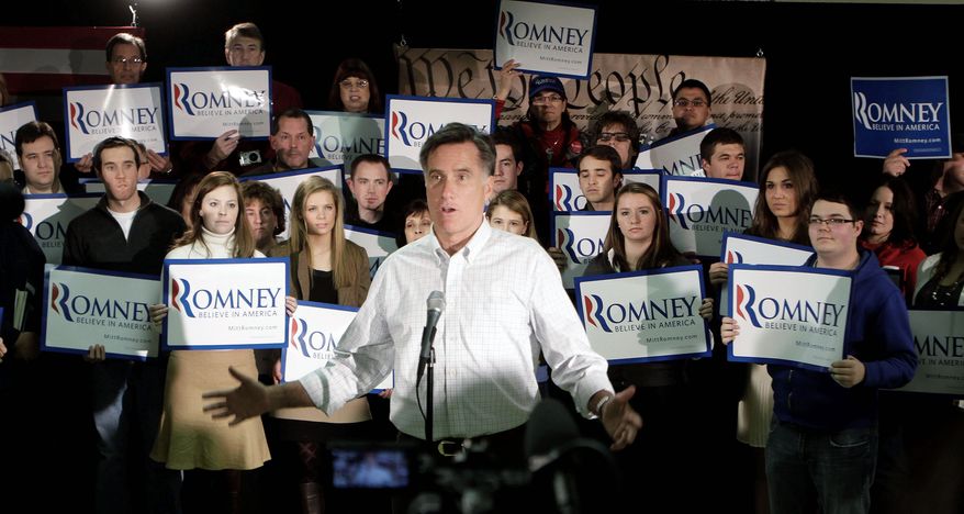 ON THE STUMP: Mitt Romney talks to reporters after the We the People Presidential Forum at a VFW Post in Hudson, N.H., on Sunday. The rise of challenger Newt Gingrich has stirred up the Romney super PAC, Restore Our Future. (Associated Press)