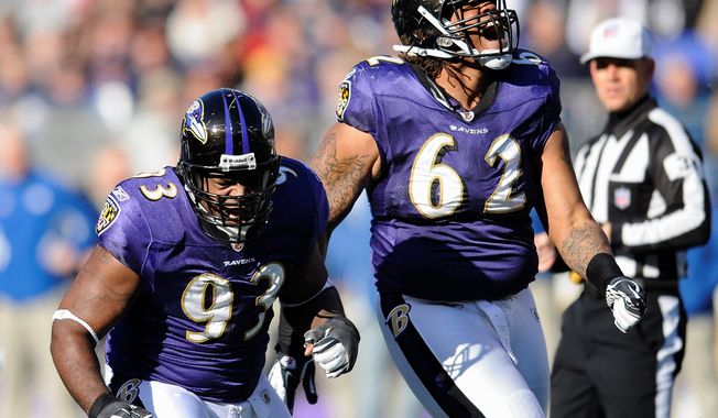 Baltimore defensive end Cory Redding (left) and nose tackle Terrence Cody react after making a tackle at the line of scrimmage during the first half. The Ravens held Indianapolis to 167 yards in their 24-10 win. (Associated Press)