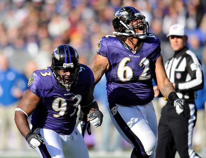 Baltimore defensive end Cory Redding (left) and nose tackle Terrence Cody react after making a tackle at the line of scrimmage during the first half. The Ravens held Indianapolis to 167 yards in their 24-10 win. (Associated Press)