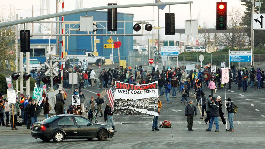 Protesters in Oregon set up a picket line at a Port of Portland terminal on Monday, a "day of action" on the West Coast that affected shipping from California to British Columbia. The anti-Wall Street protesters had the idea that if they cut off the ports, they cut into corporate profits. (Associated Press)