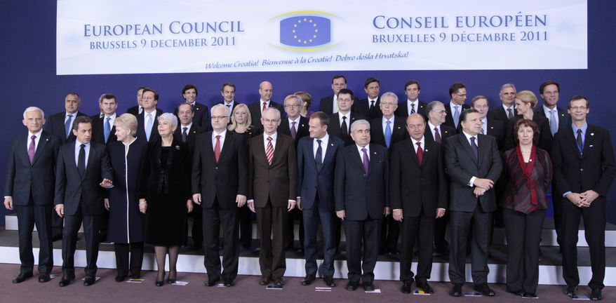EU heads of state pose for a group photo at an EU summit in Brussels on Friday, Dec. 9, 2011. First row from left to right: European Parliament President Jerzy Buzek, French President Nicolas Sarkozy, Lithuania's President Dalia Grybauskaite, Croatia's Prime Minister Jadranka Kosor, Croatia's President Ivo Josipovic, European Council President Herman Van Rompuy, Poland's Prime Minister Donald Tusk, Cypriot President Dimitris Christofias, Romania's President Traian Basescu, European Commission President Jose Manuel Barroso, EU foreign policy chief Catherine Ashton, and European Council Secretary-General Uwe Corsepius. Second row left to right: Bulgarian Prime Minister Boyko Borissov, Estonia's Prime Minister Andrus Ansip, British Prime Minister David Cameron, Malta's Prime Minister Lawrence Gonzi, Slovakia's Prime Minister Iveta Radicova, Luxembourg's Prime Minister Jean-Claude Juncker, Latvian Prime Minister Valdis Dombrovskis, Italy's Prime Minister Mario Monti, Greek Prime Minister Lucas Papademos, Irish Prime Minister Enda Kenny, Denmark's Prime Minister Helle Thorning-Schmidt. Top row left to right: Hungarian Prime Minister Viktor Orban, Belgium's Prime Minister Elio Di Rupo, Spain's Prime Minister Jose Luis Rodriguez Zapatero, Swedish Prime Minister Fredrik Reinfeldt, German Chancellor Angela Merkel, Czech Republic's Prime Minister Petr Necas, Slovenia's Prime Minister Borut Pahor, Portugal's Prime Minister Pedro Passos Coelho, Finland's Prime Minister Mari Kiviniemi, Austrian Chancellor Werner Faymann, and Dutch Prime Minister Mark Rutte. (AP Photo/Yves Logghe)
