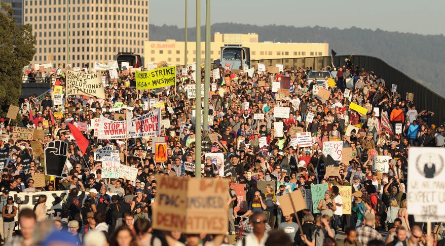 **FILE** Occupy Oakland protesters march through the Port of Oakland, Calif., on Nov. 2, 2011. (Associated Press)