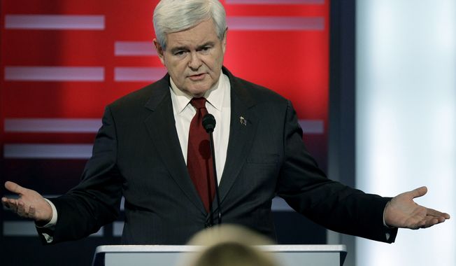 ** FILE ** Republican presidential hopeful Newt Gingrich speaks Dec. 10, 2011, during a GOP presidential debate in Des Moines, Iowa. (Associated Press)