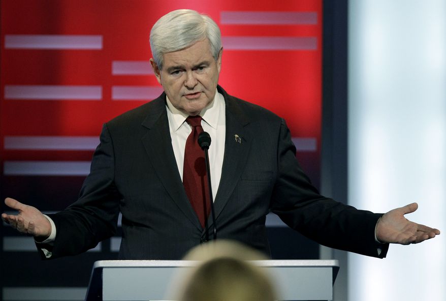 ** FILE ** Republican presidential hopeful Newt Gingrich speaks Dec. 10, 2011, during a GOP presidential debate in Des Moines, Iowa. (Associated Press)