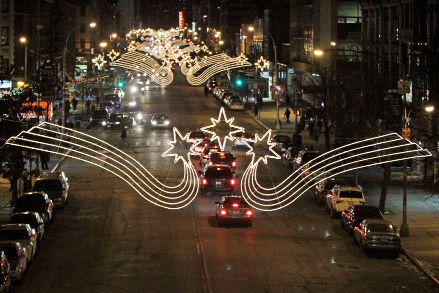 **FILE** Christmas lights illuminate 125th Street in Harlem. (Associated Press)