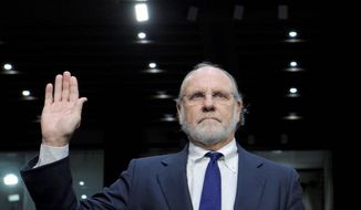 Former MF Global Holdings CEO Jon Corzine is sworn in Tuesday to testify before the Senate Agriculture Committee on the company&#39;s bankruptcy. A later witness challenged Mr. Corzine on when he knew of the transfer of customers&#39; money. (Associated Press)