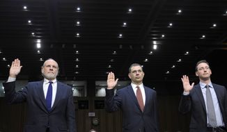 From left: Jon Corzine, former MF Global Holdings Ltd. chairman and CEO; Bradley Abelow, MF Global president and COO; and Henri Steenkamp, MF Global CFO, are sworn in Dec. 13, 2011, on Capitol Hill prior to testifying before the Senate Agriculture Committee. (Associated Press)