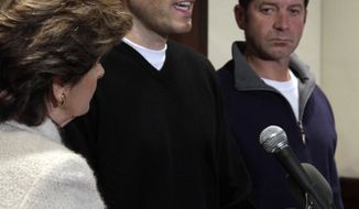 Former Syracuse ball boy Bobby Davis (center) addresses the media as former ball boy Mike Lang (right) and lawyer Gloria Allred look on during a news conference on Tuesday, Dec. 13, 2011, in New York. (AP Photo/Richard Drew)

