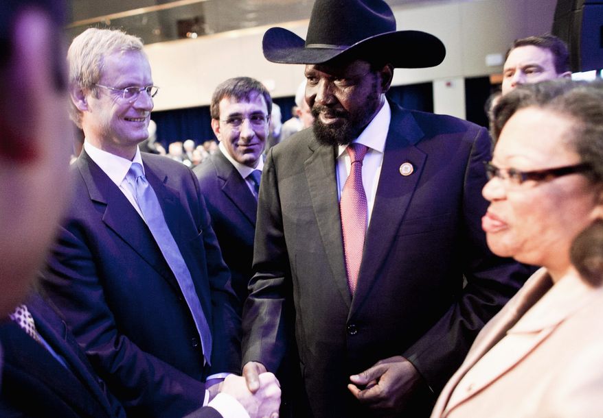 South Sudan President Salva Kiir Mayardit greets the European co-sponsors of the International Engagement Conference, including (from left) Endre Stiansen, special envoy from the Norwegian Ministry of Foreign Affairs; Cevdet Yilmaz, minister of the Turkish Ministry of Development, and Susan Page, U.S. ambassador to the Republic of South Sudan, after speaking about the Republic of South Sudan at the Marriott Wardman Park on Wednesday. (T.J. Kirkpatrick/The Washington Times)