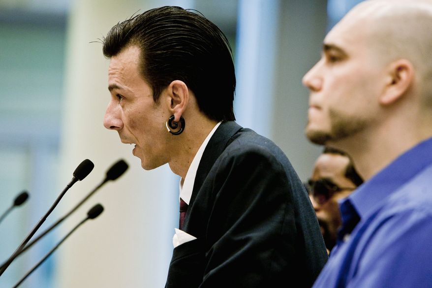 Paul Roe, owner of Britishink Tattoo Studio in the District, speaks in favor of regulations on city tattoo and body-piercing businesses as he testifies Wednesday before the D.C. Council's public services committee, chaired by Yvette M. Alexander. With him is Matt Jessup, owner of Fatty's Custom Tattooz. (T.J. Kirkpatrick/The Washington Times)