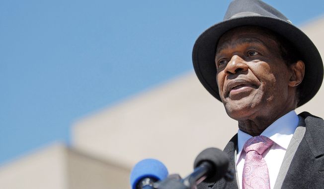 D.C. Council member Marion Barry, who owes the federal government more than $277,000 in back taxes, interest and penalties, answers questions of reporters after leaving the federal court house where he testified in Washington, D.C., Thursday, April 16, 2009. (Astrid Riecken/The Washington Times)