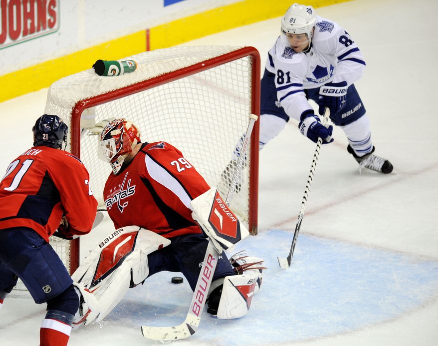 The Capitals' Tomas Vokoun has allowed some soft goals in recent games, including this tap-in by Toronto's Phil Kessel on Dec. 9. (Associated Press)