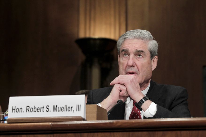 FBI Director Robert S. Mueller III testifies before the Senate Judiciary Committee on Capitol Hill in Washington on Wednesday, Dec. 14, 2011. (AP Photo/J. Scott Applewhite)