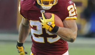 Washington Redskins running back Roy Helu (29) carries the ball during the first half against the New England Patriots on Sunday, Dec. 11, 2011 in Landover, Md. (AP Photo/Rich Lipski)