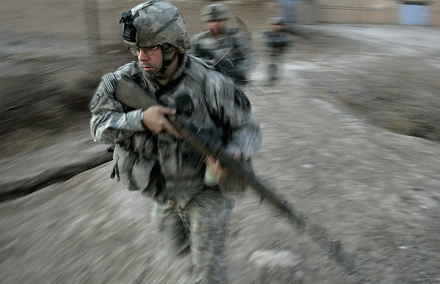 In this Dec. 23, 2007 file photo, U.S. army soldiers from Blackfoot Company, 2nd Battalion, 23rd Infantry Regiment, run to take defensive positions during a firefight on the outskirts of Muqdadiyah, in the volatile Diyala province, about 90 kilometers (60 miles) north of Baghdad. In the beginning, it all looked simple: topple Saddam Hussein, destroy his purported weapons of mass destruction and lay the foundation for a pro-Western government in the heart of the Arab world. Nearly 4,500 American and more than 100,000 Iraqi lives later, the objective now is simply to get out _ and leave behind a country where democracy has at least a chance, where Iran does not dominate and where conditions may not be good but "good enough." (AP Photo/Marko Drobnjakovic, File)
