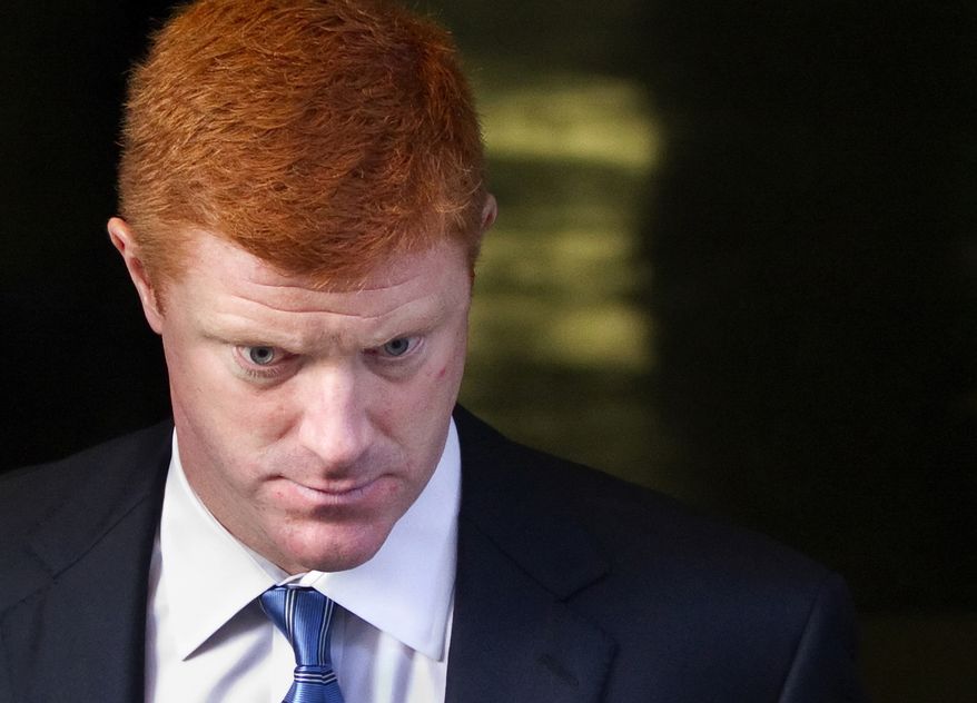 Penn State assistant football coach Mike McQueary leaves the Dauphin County Court in Harrisburg, Pa., on Dec 16, 2011. McQueary, speaking for the first time in public about the 2002 encounter in a Penn State locker room, said he believes that Jerry Sandusky was attacking a child with his hands around the boy's waist but said he wasn't completely sure it was intercourse. (Associated Press/The Patriot-News)