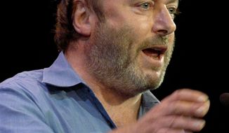 ** FILE ** Essayist Christopher Hitchens speaks during a debate on Iraq and the foreign policies of the United States and Britain, in this Sept. 14, 2005, file photo taken in New York. Vanity Fair reports Hitchens died on Thursday, Dec. 15, 2011. (AP Photo/Chad Rachman)