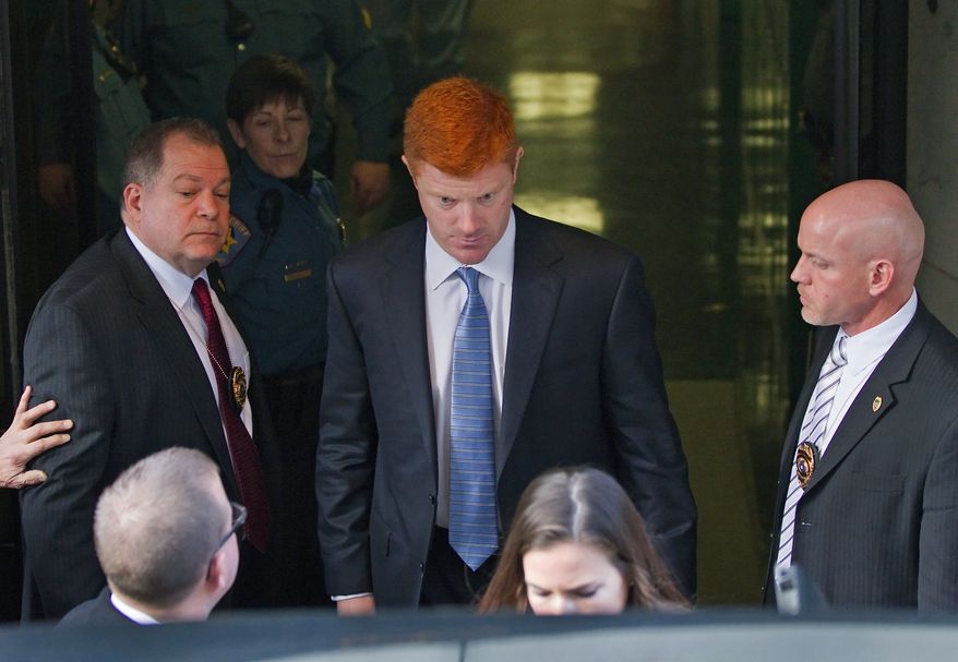 Penn State Assistant Football Coach Mike McQueary departs the Dauphin County Court Friday, Dec 16, 2011 in Harrisburg, Pa. McQueary, speaking for the first time in public about the 2002 encounter in a Penn State locker room, said he believes that Jerry Sandusky was attacking a child with his hands around the boy's waist but said he wasn't 100 percent sure it was intercourse. (AP Photo/The Patriot-News, Joe Hermitt)