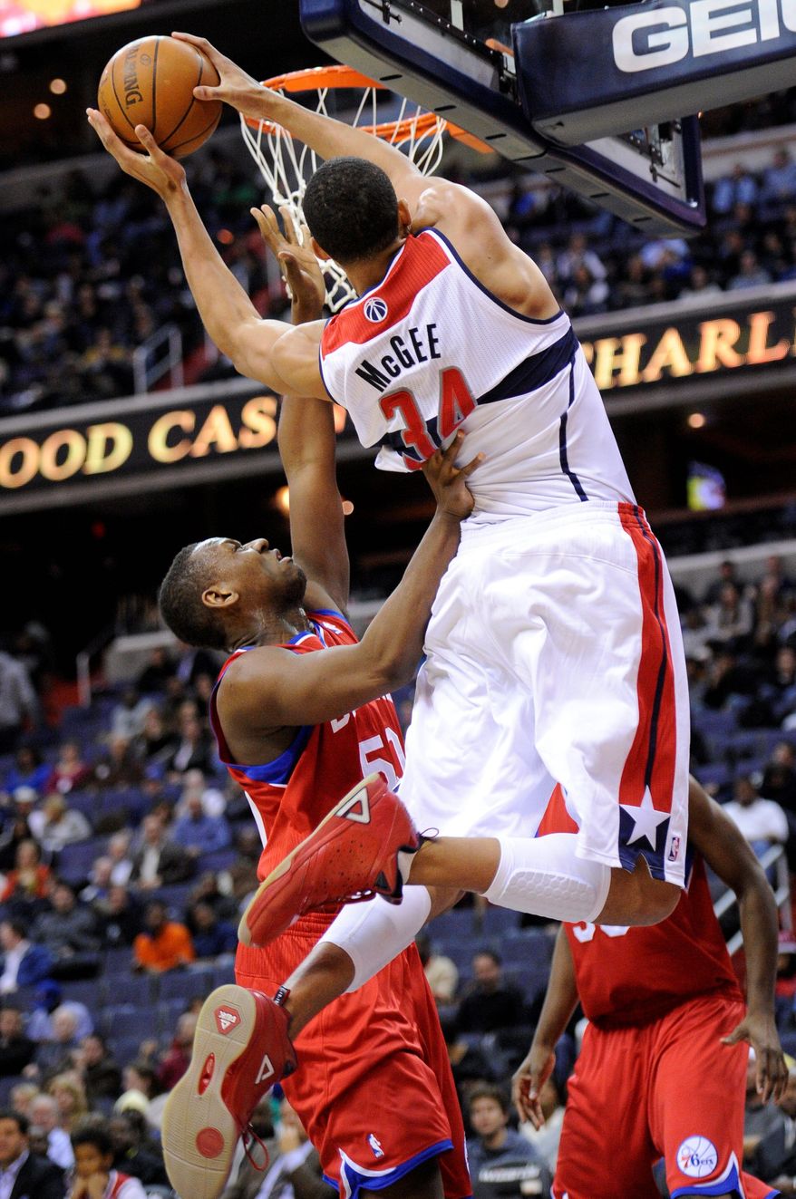 Wizards center JaVale McGee is fouled on a drive to the basket during Friday night's 103-78 exhibition loss to the Philadelphia 76ers. (Associated Press)