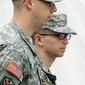 Army Pfc. Bradley Manning (right) is escorted to a military hearing at Fort Meade,, Md., on Sunday that will determine if he should face court-martial for his alleged role in the WikiLeaks classified leaks case. The hearing entered its third day Sunday. (Associated Press)