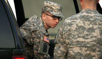 **FILE** Army Pfc. Bradley Manning is escorted from a security vehicle to a courthouse at Fort Meade, Md., on Dec. 19, 2011. (Associated Press)