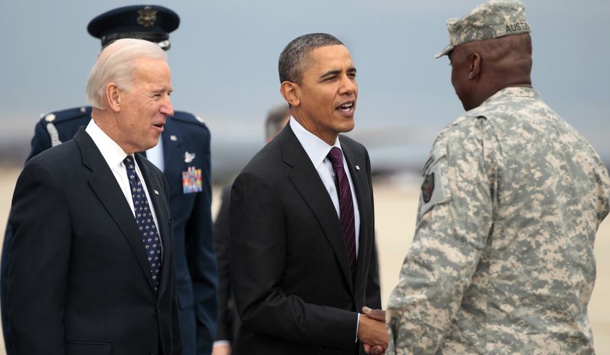 President Obama (center) and Vice President Joseph R. Biden Jr. (left) greet Gen. Lloyd Austin, the top U.S. commander in Iraq, on the apron at Joint Base Andrews outside Washington on Tuesday, Dec. 20, 2011. (AP Photo/Carolyn Kaster)