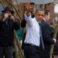 President Obama waves to people gathered outside in the rain as he shops for Christmas gifts Wednesday in Alexandria. The president&#39;s spokesman said Mr. Obama&#39;s assertion that he ranked among the greatest presidents was taken out of context. (Associated Press)