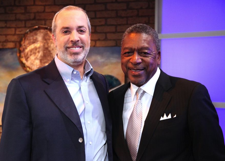 Financial whiz Ric Edelman and BET founder and business man Robert Johnson talk up "business solutions to social problems." (image from 3 Roads Communications)