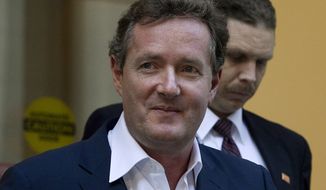 **FILE** Piers Morgan, host of CNN&#x27;s &quot;Piers Morgan Tonight,&quot; leaves the CNN building in Los Angeles on Dec. 20, 2011. (Associated Press)