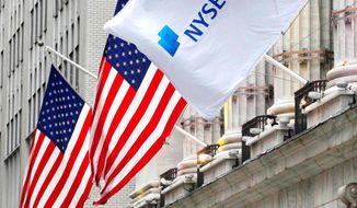 The Justice Department said it will allow a merger between the New York Stock Exchange and Deutsche Boerse AG that would create the world&#39;s largest stock exchange operator, pending the sale of a third, smaller American stock exchange operator. (The Associated Press)