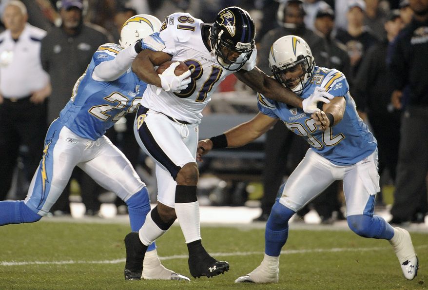FILE - In this Dec. 18, 2011, file photo, Baltimore Ravens wide receiver Anquan Boldin rushes against San Diego Chargers free safety Eric Weddle, right, and Antoine Cason during the first half of a NFL football game in San Diego. Boldin is having surgery on his knee Thursday, Dec. 22 to deal with slightly torn cartilage. (AP Photo/Denis Poroy, File)