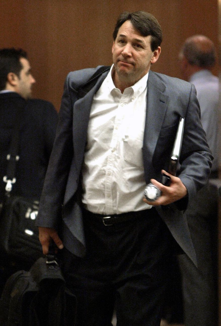 FILE - In this April 8, 2005, file photo, New York Islanders general manager Mike Milbury leaves after an NHL hockey general managers meeting at the Detroit Metropolitan Airport in Romulus, Mich. A spokesman for former Boston Bruins player and coach Milbury said on Friday, Dec. 23, 2011, that his client won't face criminal charges for a confrontation he had with a 12-year-old boy after a youth hockey game. (AP Photo/Paul Sancya, File)
