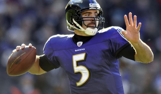 Baltimore Ravens quarterback Joe Flacco sets to throw in the first half of an NFL football game against the Cleveland Browns in Baltimore, Saturday, Dec. 24, 2011. (AP Photo/Gail Burton)