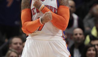 New York Knicks forward Carmelo Anthony (7) celebrates during the second half of the Knicks&#x27; 106-104 victory over the Boston Celtics in the NBA basketball season opener, in New York on Sunday, Dec. 25, 2011. Anthony scored 37 points. (AP Photo/Kathy Willens)