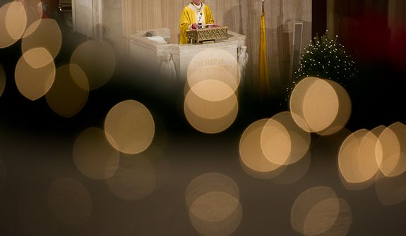 Archbishop of Washington Cardinal Donald Wuerl speaks to worshippers at Christmas Mass held at the Basilica of the National Shrine of the Immaculate Conception on Christmas Day, Washington, D.C., Sunday, Dec. 25, 2011. (Andrew Harnik/The Washington Times)