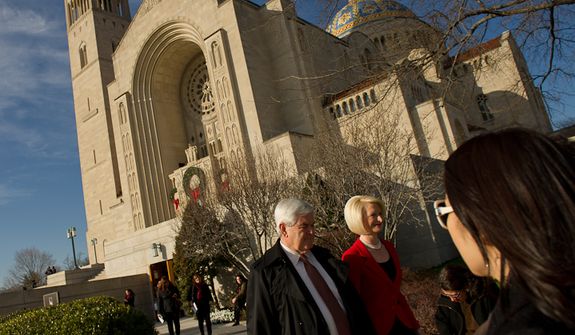Former Speaker of the House and current Republican presidential candidate Newt Gingrich and his wife Callista Gingrich depart following Christmas Mass at the Basilica of the National Shrine of the Immaculate Conception on Christmas Day, Washington, D.C., Sunday, Dec. 25, 2011. (Andrew Harnik/The Washington Times)