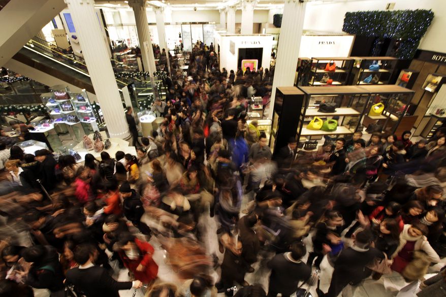 Shoppers rush into a London department store as it opens for Boxing Day sales on Monday, Dec. 26, 2011. (AP Photo/Lefteris Pitarakis)