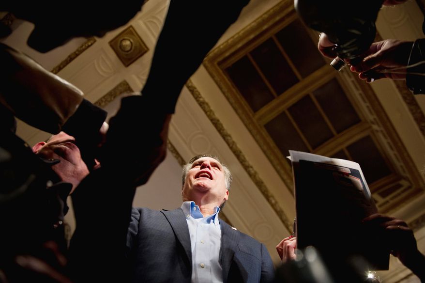 Republican presidential hopeful Mitt Romney greets supporters after delivering a speech kicking off his Iowa bus tour at a hotel in Davenport, Iowa, on Tuesday. The former Massachusetts governor chided President Obama for broken promises. (Andrew Harnik/The Washington Times)