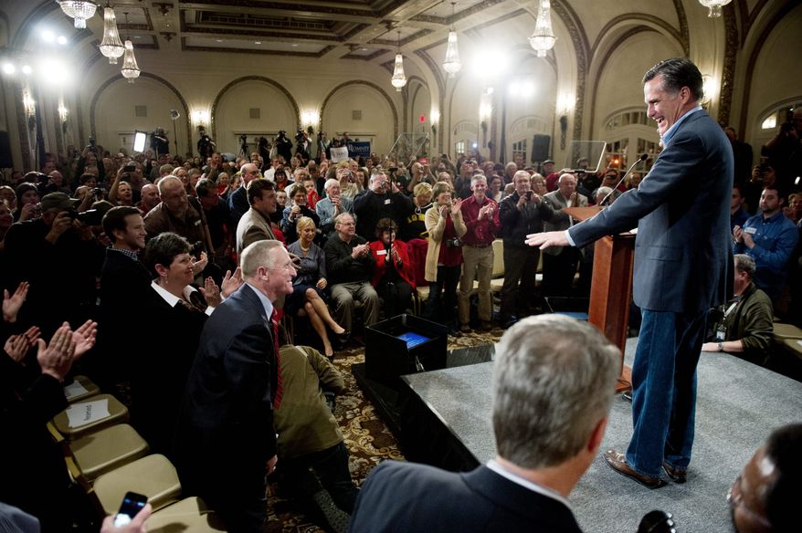 'OUR TIME': Republican presidential hopeful Mitt Romney delivers a speech Tuesday at a hotel in Davenport, Iowa. The former Massachusetts governor said the 2012 presidential election will be "an election to save the soul of America." (Andrew Harnik/The Washington Times)