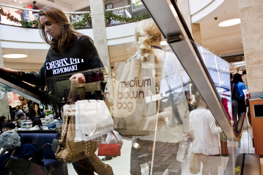 Shoppers crowd the Tysons Corner Center mall in McLean, Va. on Dec. 26, 2011. The National Retail Federation projected this years' holiday sales to be up 3 percent over last year, but the Tysons mall is up 4 percent over last year's sales figures for the Black Friday to Christmas Eve period.
(T.J. Kirkpatrick/ The Washington Times)
