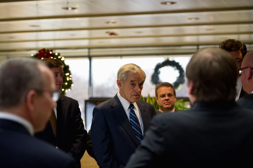 Republican presidential candidate Ron Paul arrives at GuideOne Insurance to deliver a speech to employees at their offices in West Des Moines, Iowa, on Wednesday. The representative from Texas holds a slight lead in the RealClearPolitics.com average of polls with less than a week to go until the caucuses Tuesday. (Andrew Harnik/The Washington Times)