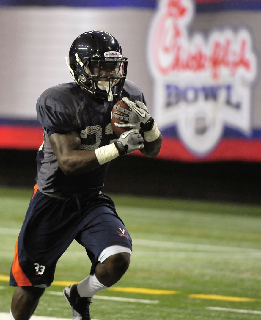 Virginia tailback Perry Jones runs during practice for the Chick-fil-A Bowl at the Georgia Dome on Tuesday, Dec. 27, 2011, in Atlanta. (AP Photo/David Tulis)