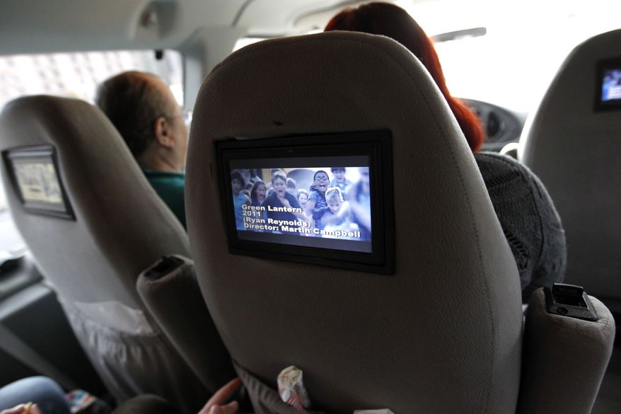 A clip from the movie 'Green Lantern' is seen on the video screen of a movie tour van in New Orleans. New Orleans Movie Tours takes passengers aboard a van equipped with movie screens and a sound system to locations where famous movie scenes were filmed. Tours last approximately two hours and include video clips from roughly 30 movies. (AP Photo/Gerald Herbert)
