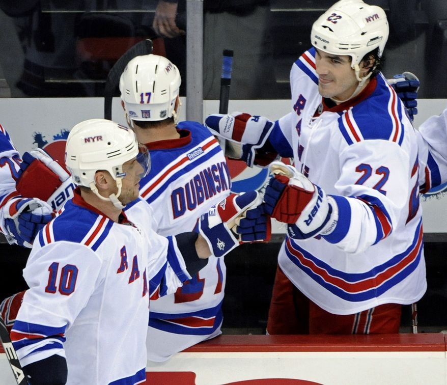 New York Rangers' Brian Boyle (right) has two goals and eight points this season in a third-line center role. His 6-foot-7 frame also makes him a valuable penalty killer. (AP Photo/Bill Kostroun)