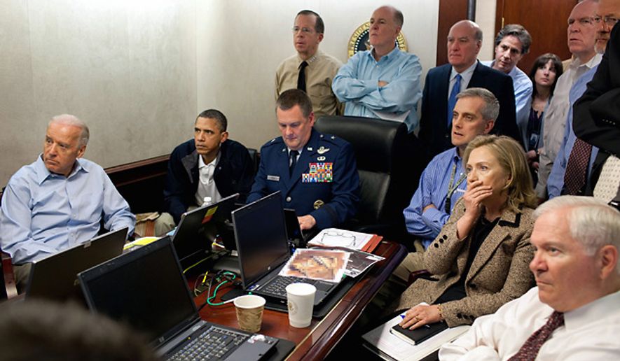 In this image released by the White House, Secretary of State Hillary Rodham Clinton, President Barack Obama and Vice President Joe Biden, along with with members of the national security team, receive an update on the mission against Osama bin Laden in the Situation Room of the White House, Sunday, May 1, 2011. (AP Photo/The White House, Pete Souza)