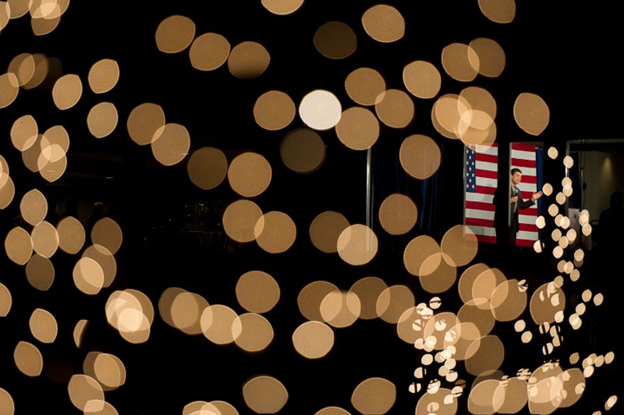 Republican presidential candidate Rick Perry, right, speaks at a fundraiser held in the evening at the Mason City Country Club, Mason City, Iowa, Friday, Dec. 30, 2011. (Andrew Harnik/The Washington Times)