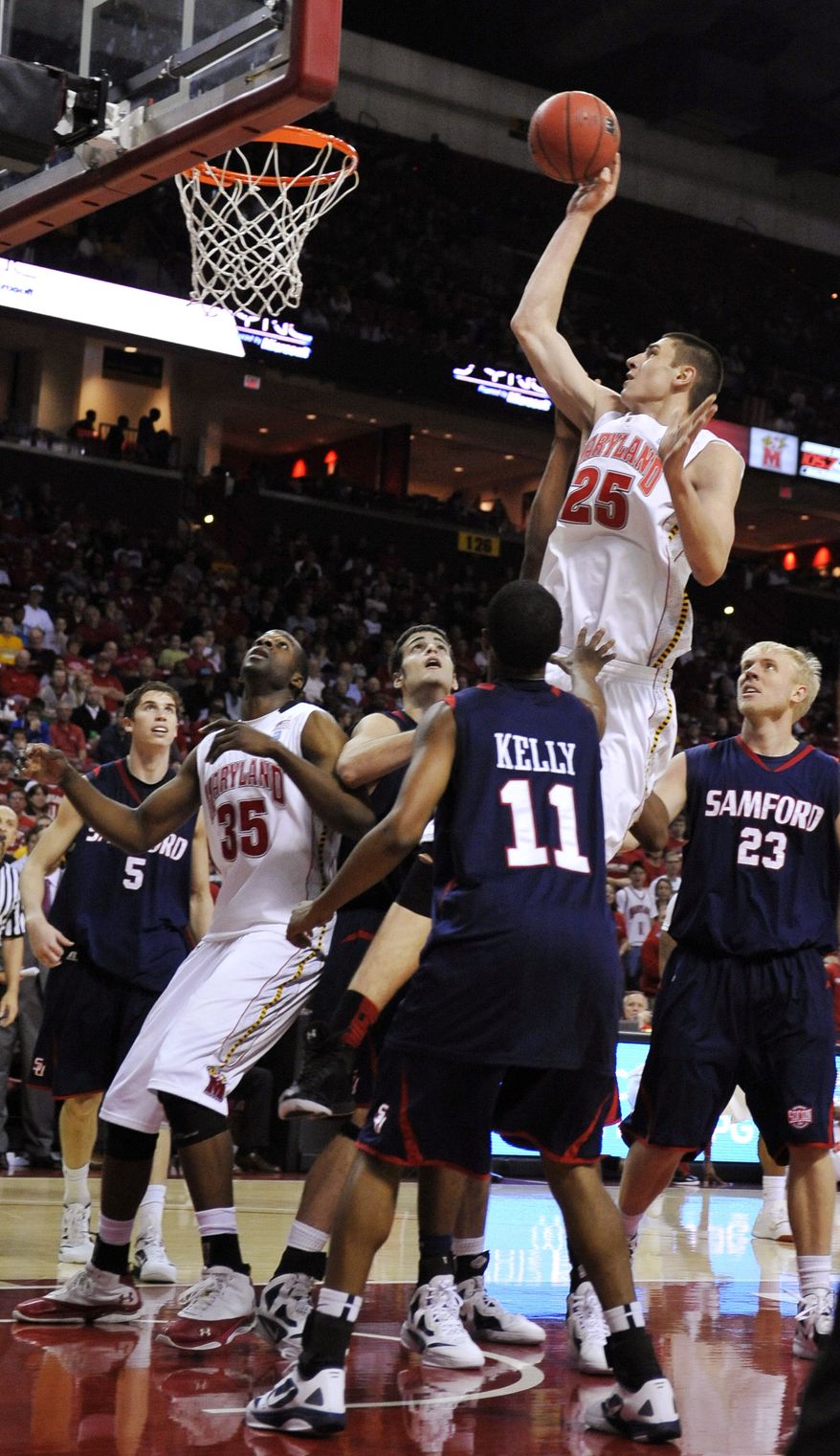 Maryland's Alex Len shoots over the Samford defense in the second half, Saturday, Dec. 31, 2011, in College Park, Md. Maryland won 75-63, and Len had 13 points and seven rebounds. (AP Photo/Gail Burton)