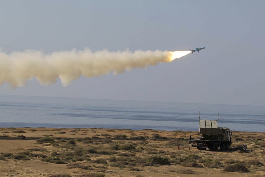 A Ghader missile is launched Jan. 2, 2012, at the shore of sea of Oman during Iran's navy drill. Iran test-fired a surface-to-surface cruise missile during a drill that the country's navy chief said proved Tehran was in complete control of the strategic Strait of Hormuz, the passageway for one-sixth of the world's oil supply. (Associated Press/Fars News Agency)